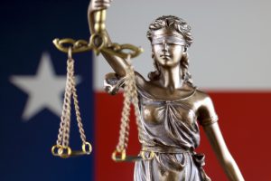 Texas Flag and Lady Justice