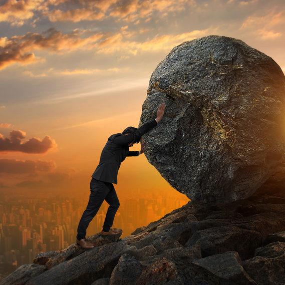 BUSINESS – MAN PUSHING BOLDER UP MOUNTAIN Pushing Boulder Up Mountain