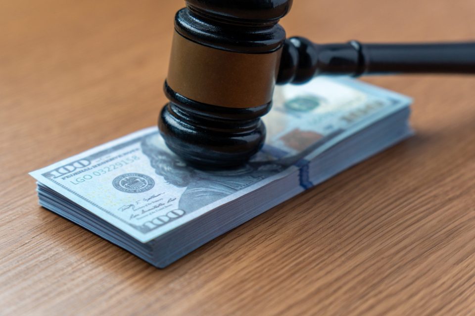 A,Judge’s,Gavel,On,A,Stack,Of,One,Hundred,Dollar
